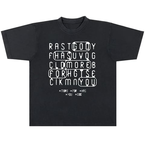 Black t-shirt with white pixelated text forming a word puzzle grid design and mathematical equations at the bottom