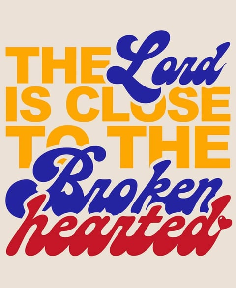 Vintage typography poster with yellow, blue, and red text reading The Lord Is Close To The Broken Hearted on beige background
