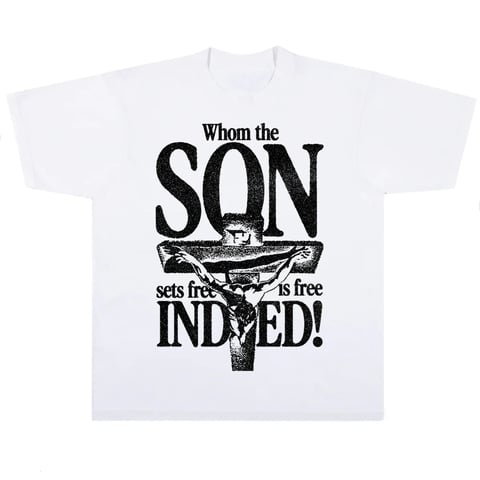 White t-shirt with black text reading Whom the SON sets free is free INDEED, featuring a crucifix design in the center